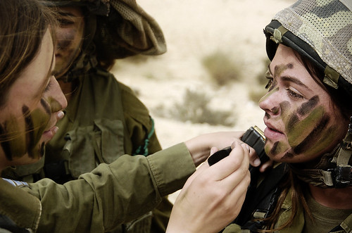 Female Soldiers Apply Camouflage Face Paint
