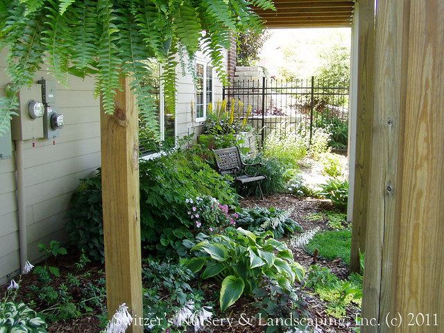 Gardening under the deck... sure! it's aperfect place for a shade garden! This deck is on the side of the house and makes a wonderful place for a secrete garden. A perfect place to get away from it all and just relax.
