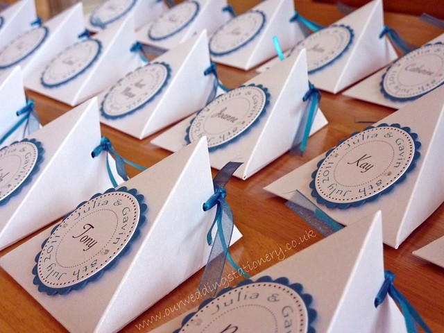 Handmade wedding favour boxes place cards filled with white sugared almonds