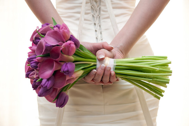 This is a fresh calla lily wedding bouquet made with pink roses and white 