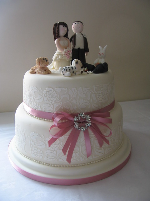 2 tier wedding cake with bride and groom topper and ivory vintage 