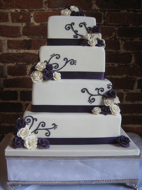 purple and ivory 4 tier wedding cake