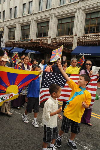 Tibetan children, people parade for World Peace with Tibetan & American Flags, near Verizon Center where Kalachakra is being given by His Holiness the 14th Dalai Lama, Washington D.C., USA by Wonderlane