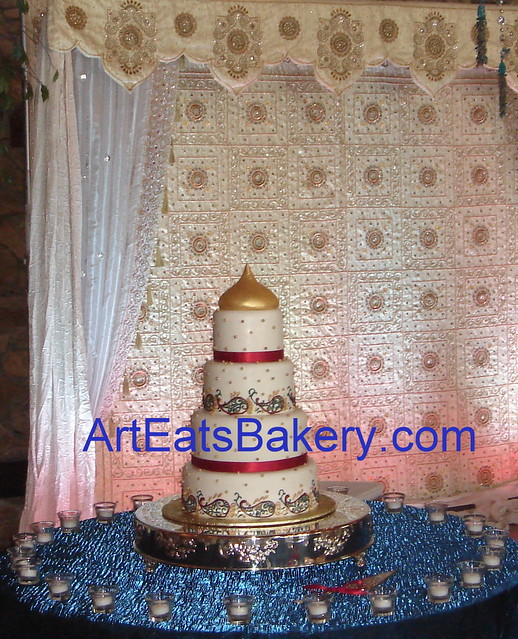  wedding cake with varied gold and copper sugar pearls red teal and 
