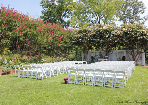 The ceremony was on a croquet lawn at the venue with flowering trees around 