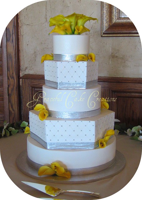 Elegant White and Silver Wedding Cake with Yellow Calla Lilies