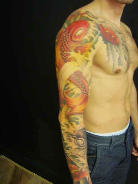 Koi sleeve tattoo 20 hours in Tribe tattoo studio