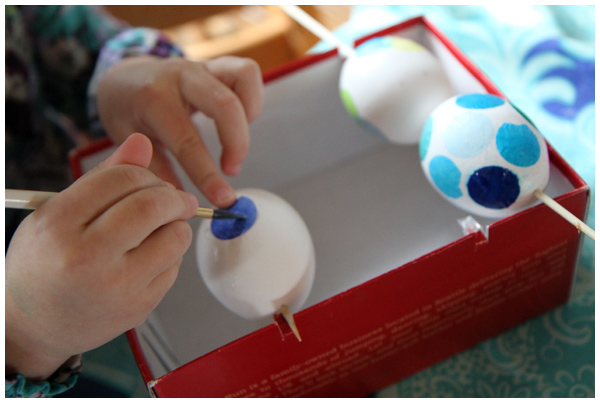 Decoupage Easter eggs with tissue paper circles
