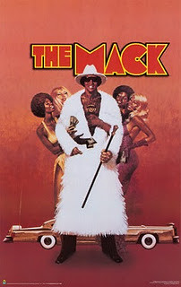 movie poster featuring a black man in a fur coat flanked by women called The Mack