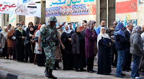 Soldiers patrols the lines of voters in Egypt who are participating in the first post-uprising elections on November 28, 2011. Egypt has been rocked by unrest over the last year. by Pan-African News Wire File Photos