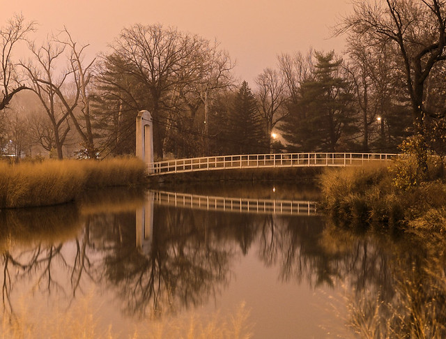 Forest Park, in Saint Louis, Missouri, USA - suspension bridge at night in fog