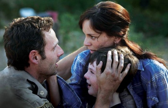 Scene from the Walking Dead. Lori and Rick embracing with their child between them