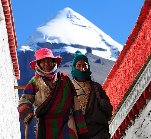 Pilgrims circumambulate the Choku monastery, Mount Kailash in the background. Tibet by reurinkjan