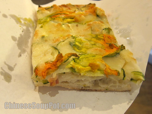 [photo-slice of zucchini flower pizza]