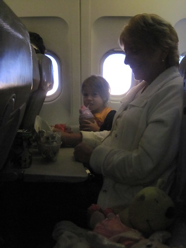 Madison on the plane with Grandma