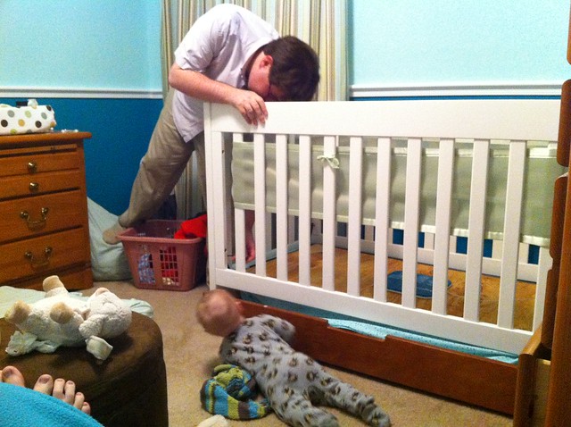Lowering George's crib mattress.