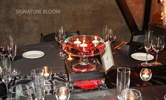 This winter arrangement was designed with red rose petals and James Storie