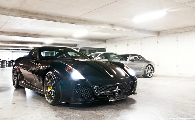The awesome black Ferrari 599 GTO among many other exotics in the garage