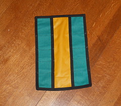 Bright green tool roll with yellow lining