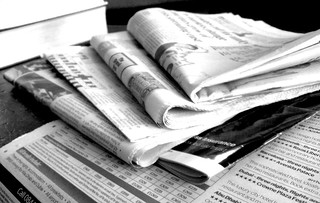 Newspapers in black and white. Image from NS Newsflash on Flickr
