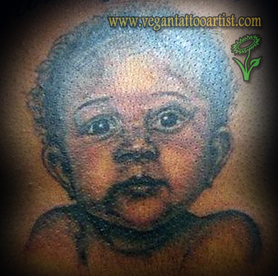child portrait tattoo dark skin