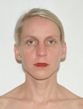 white woman staring at the camera with red lips