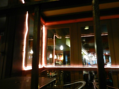 Ghost face, window reflection and lights, The Ave, U District, Seattle, Washington, USA by Wonderlane