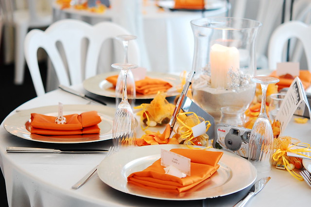 Joyce Ben's Wedding Table setting Orange with a beach theme
