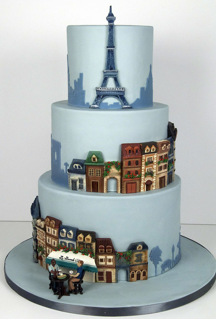 A Parisian Theme wedding cake with the Eiffel Tower and quaint Paris street