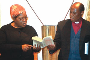 Vice President Joice Mujuru and Bishop Eben Kanukai Nhiwatiwa of the United Methodist Church sing a hymn at her Chisipite home in Harare yesterday. by Pan-African News Wire File Photos