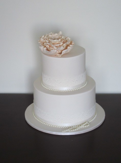 Lace Pearl Wedding Cake Edible lace and pearls surround this dummy cake