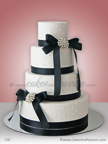 Decorated with pearl piping pearl and diamond brooches black satin ribbons 