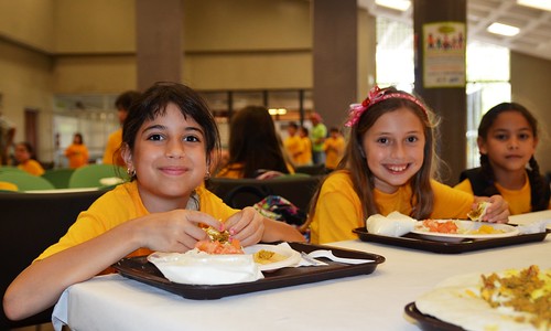 Children enjoy lunch freshly prepared and served on-site at the Inter Metro Summer Recreation Program in San Juan, Puerto Rico.