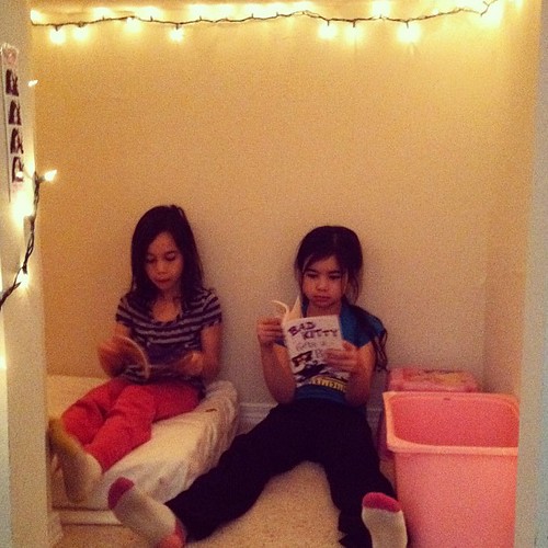 I just spent half the day transforming a messy closet into a reading nook for the kids.