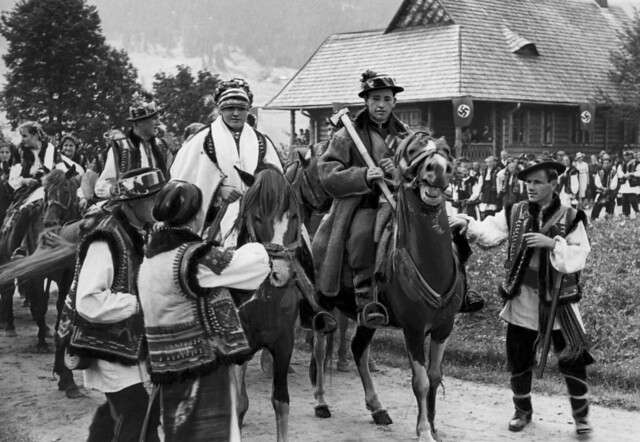 Hutsul wedding procession And the swastika in the background