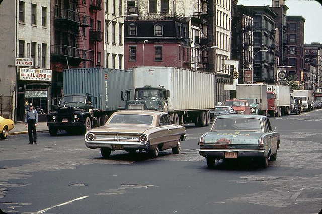 A 1960s Ford Galaxie and a battered early 1960s Plymouth 
