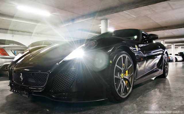 The awesome black Ferrari 599 GTO among many other exotics in the garage