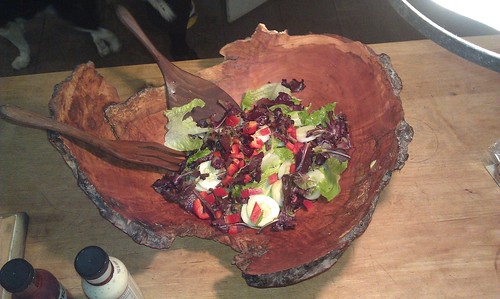 Salad in a beautifully carved wooden bowl