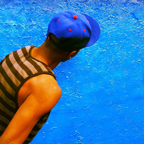 Blue hat blue wall by springknitter