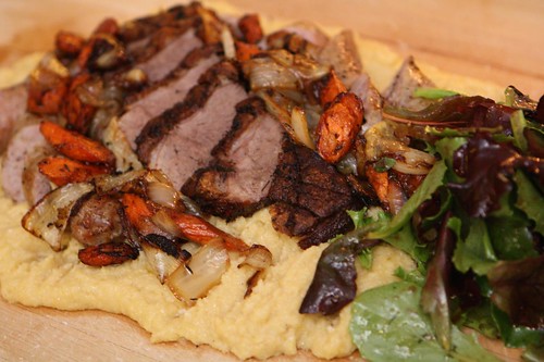 Roasted Duck Breast, Sausage, and Vegetables on Creamy Polenta