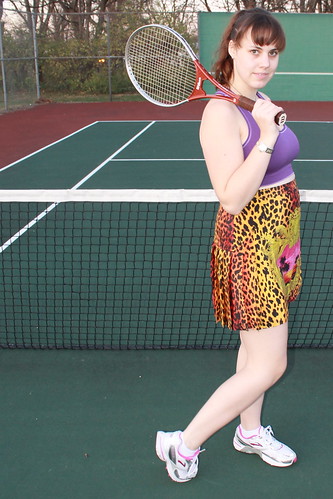 Tennis outfit: Versace for H&M silk pleated skirt, Brooks running shoes, Champion sports bra, vintage Wilson tennis racket