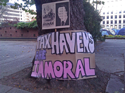 Tax havens are immoral poster on tree