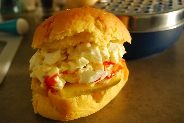 Egg salad with hot sauce in a bun