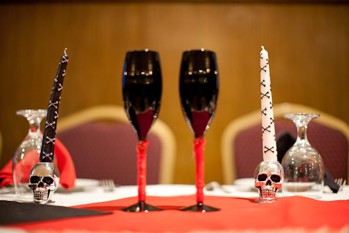 wedding reception glasses and skull candle holders for a Halloween wedding