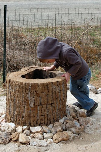 This young man tossed several pieces of quartz into the wishing well at James River State Park's Discovery Area.