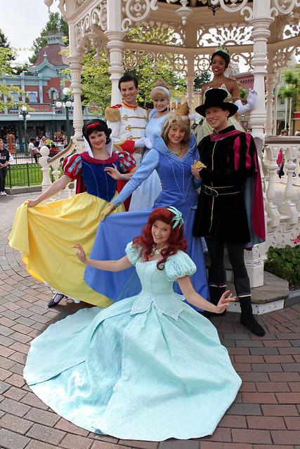 The Princes and Princesses pose for pictures in Town Square