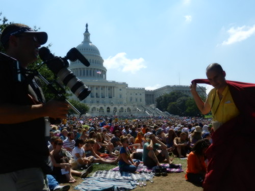 Photographer and Tibetan Buddhist monk, US Capitol building, crowd sitting on the western capitol lawn listening to His Holiness the 14th Dalai Lama speak about peace and religion, Kalachakra for World Peace, Washington D.C., USA by Wonderlane