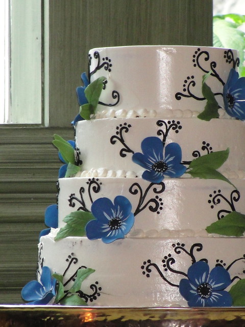 Black white and blue wedding cake Alternating layers of carrot cake with 