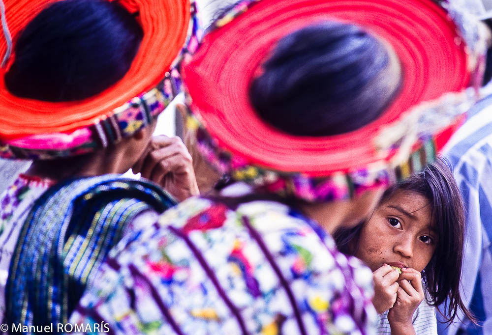 Guatemala, sweet little girl, colored hats