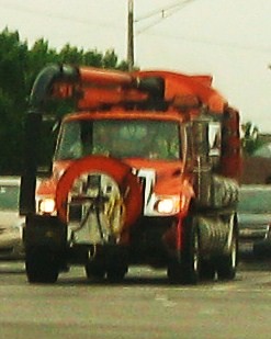 An orange International sewer maintenance truck. Morton Grove Illinois USA. Early August 2011. by Eddie from Chicago